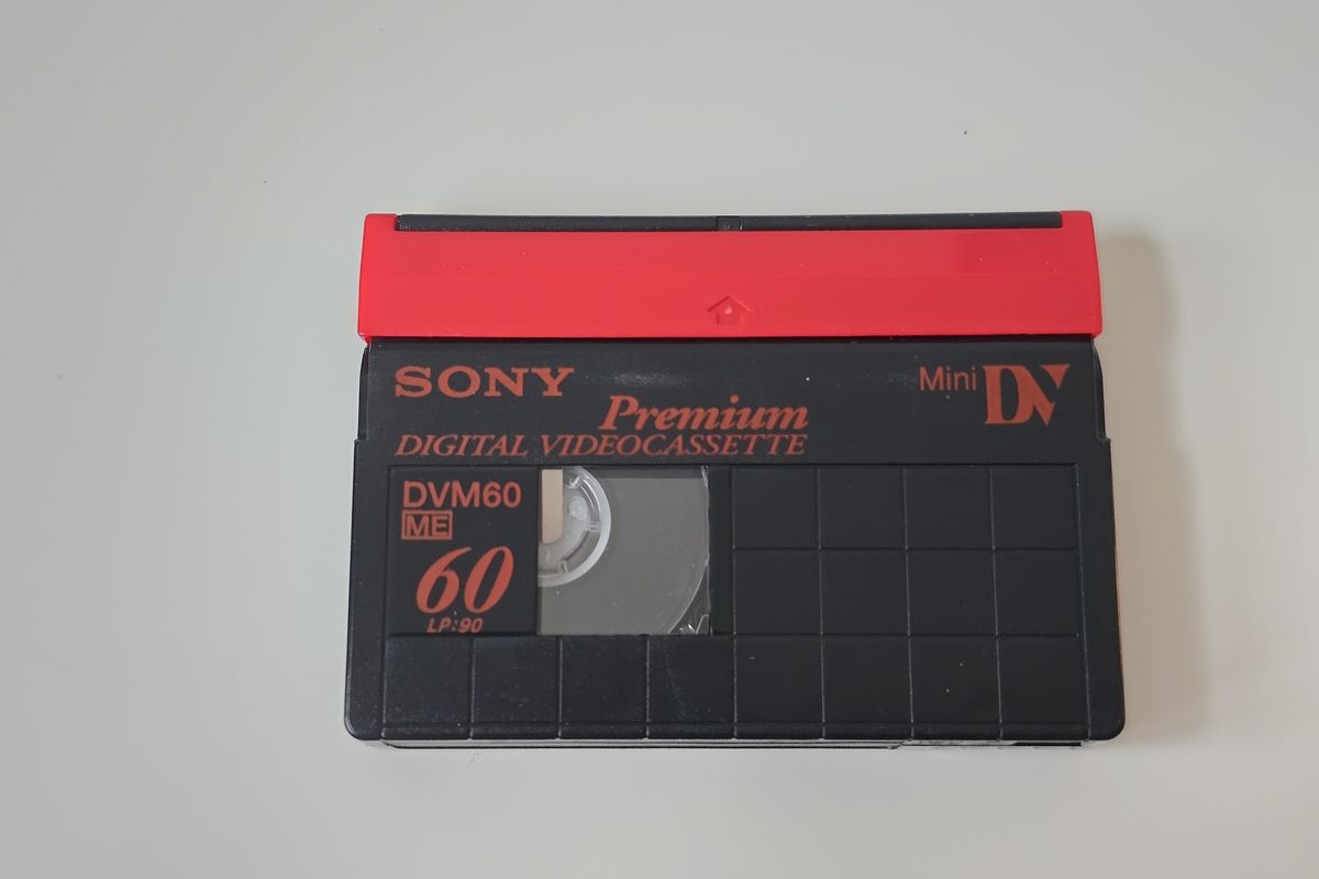 A Sony Premium MiniDV tape with a red top edge and DV logo